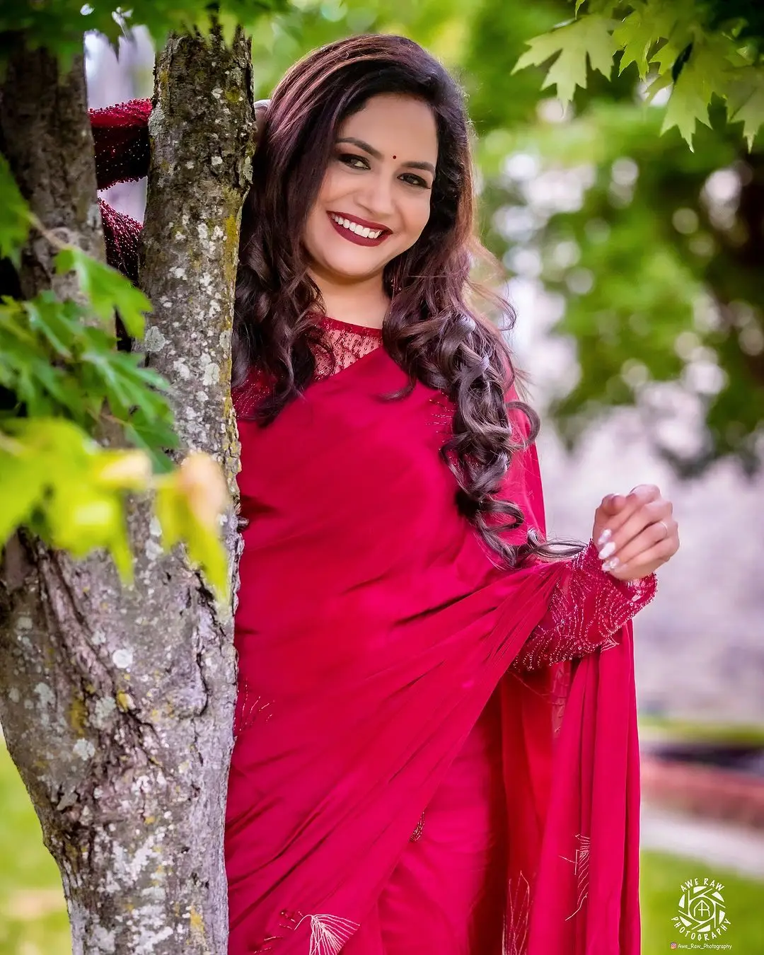 Telugu Singer Sunitha Stills In Maroon Saree Blouse